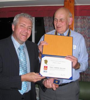 Nicholas Smith receives his Paul Harris Fellowship from club President David Thorpe